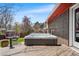 Outdoor hot tub on a wooden deck is perfect for relaxing and enjoying the backyard view at 8320 W Harvard Dr, Lakewood, CO 80227