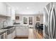 Modern kitchen features stainless steel appliances, granite countertops and a dining nook at 8320 W Harvard Dr, Lakewood, CO 80227