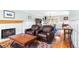 Comfortable living room with a white fireplace and two leather armchairs; decorative wainscoting at 8320 W Harvard Dr, Lakewood, CO 80227