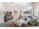 Comfortable open concept living area features stairs and an upstairs half wall at 8320 W Harvard Dr, Lakewood, CO 80227