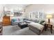 Relaxing living room with neutral tones, a large sectional sofa and bright natural light at 8320 W Harvard Dr, Lakewood, CO 80227