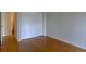 Bright bedroom featuring sleek bamboo floors, a spacious closet, and fresh neutral paint at 3494 S Eagle St # 202, Aurora, CO 80014