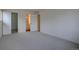 Bedroom providing ensuite bathroom access and hallway access in the interior at 3494 S Eagle St # 202, Aurora, CO 80014