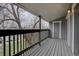 Balcony with wood deck, railing, and a storage closet on the side at 3494 S Eagle St # 202, Aurora, CO 80014
