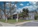 Condominium exterior with gray siding, stone accents, wooden balconies, and well-maintained landscaping at 3494 S Eagle St # 202, Aurora, CO 80014