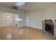Open living space with a stone fireplace, hardwood floors, ceiling fan and view to the kitchen at 3494 S Eagle St # 202, Aurora, CO 80014