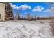 Large backyard area with partial snow coverage and ample space for various activities at 3865 Independence Ct, Wheat Ridge, CO 80033
