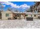Back of house featuring a hot tub, grill and covered outdoor seating area at 3865 Independence Ct, Wheat Ridge, CO 80033