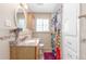 Bathroom featuring tiled walls, granite countertops and decorative shower curtain at 3865 Independence Ct, Wheat Ridge, CO 80033