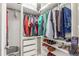 Organized walk-in closet with clothing racks, shelves, and drawers for efficient storage at 3865 Independence Ct, Wheat Ridge, CO 80033