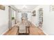 Dining room with a large table, barn door, and stylish decor for an open concept feel at 3865 Independence Ct, Wheat Ridge, CO 80033