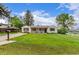 Charming one-story home featuring a well-manicured lawn and inviting covered porch at 3865 Independence Ct, Wheat Ridge, CO 80033