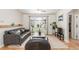 Bright living room with hardwood floors, neutral walls, and modern furnishings at 3865 Independence Ct, Wheat Ridge, CO 80033