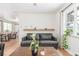 Bright living room featuring hardwood floors, comfortable seating, and natural light at 3865 Independence Ct, Wheat Ridge, CO 80033