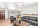 Open living area with hardwood floors, comfortable seating, and large windows for natural light at 3865 Independence Ct, Wheat Ridge, CO 80033