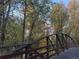 Picturesque bridge view with lush, colorful trees in the background, close to the home at 3865 Independence Ct, Wheat Ridge, CO 80033