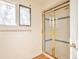 Bathroom featuring glass enclosed shower and window at 8055 S Zephyr Way, Littleton, CO 80128