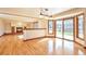 Open dining area with hardwood floors, a fireplace, and sliding glass doors to the yard at 8055 S Zephyr Way, Littleton, CO 80128