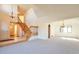 Spacious entryway featuring a staircase and light-colored carpet at 8055 S Zephyr Way, Littleton, CO 80128