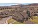 Aerial view of a house with well-maintained landscaping and mountain views at 10441 W Remington Dr, Littleton, CO 80127