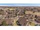 Beautiful aerial shot showcasing the neighborhood, lake, and green spaces of the surrounding community at 10441 W Remington Dr, Littleton, CO 80127