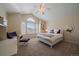 Bright, spacious bedroom with vaulted ceilings, large windows, and neutral decor at 10441 W Remington Dr, Littleton, CO 80127