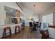 Cozy dining area with hardwood floors, modern lighting, and access to the outdoor patio at 10441 W Remington Dr, Littleton, CO 80127