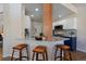 Modern kitchen featuring a breakfast bar, stainless steel appliances, and stylish cabinetry at 10441 W Remington Dr, Littleton, CO 80127