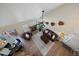 Open-concept living area boasts a fireplace, ceiling fan, and wood floors, creating a warm and inviting atmosphere at 10441 W Remington Dr, Littleton, CO 80127