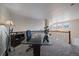 The upstairs office is well-lit and overlooks the dining area providing a great workspace at 10441 W Remington Dr, Littleton, CO 80127