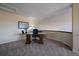 This carpeted office space offers privacy and an ergonomic setup for focused work, with a large table for spreading out at 10441 W Remington Dr, Littleton, CO 80127