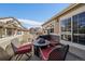 Cozy patio featuring a fire pit, comfortable seating, and views of the property at 10441 W Remington Dr, Littleton, CO 80127