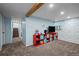 Finished basement with carpeting, storage, and access to the staircase at 3767 E Phillips Cir, Centennial, CO 80122