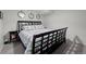 Bedroom with an elegant bed, stylish bedding, and a dark wood frame, offering a serene retreat at 3767 E Phillips Cir, Centennial, CO 80122
