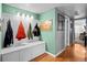 Hallway with coat rack, built in bench with storage, and hardwood floors at 3767 E Phillips Cir, Centennial, CO 80122