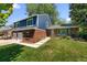 Charming two-story home featuring brick accents, attached two car garage, and a lush green front yard at 3767 E Phillips Cir, Centennial, CO 80122