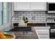 Modern kitchen features updated fixtures, dark countertops, and a bright window view at 3767 E Phillips Cir, Centennial, CO 80122