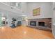 Spacious living room featuring a fireplace, hardwood floors, and ample natural light at 3767 E Phillips Cir, Centennial, CO 80122