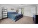 Spacious main bedroom with neutral walls, a ceiling fan, and a modern sliding door at 3767 E Phillips Cir, Centennial, CO 80122