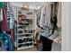 Organized walk-in closet with shelving, hanging rods, and ample storage space for clothes and shoes at 3767 E Phillips Cir, Centennial, CO 80122