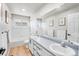 Bright bathroom with double sinks, modern fixtures, large mirrors, and stylish vanity at 22678 E Lake Pl, Centennial, CO 80015