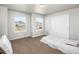 Bright bedroom with closet, neutral paint, and big windows offering neighborhood views at 22678 E Lake Pl, Centennial, CO 80015
