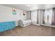 Bedroom featuring carpet, a large window, a dresser, and light colored walls at 22678 E Lake Pl, Centennial, CO 80015