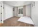 Clean bedroom featuring carpet, light walls, closet, and large window at 22678 E Lake Pl, Centennial, CO 80015
