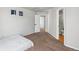 Clean bedroom featuring carpet, light walls, open door, and window at 22678 E Lake Pl, Centennial, CO 80015