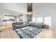 Expansive living room featuring hardwood floors, an open layout, and views into the kitchen at 22678 E Lake Pl, Centennial, CO 80015