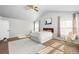 Spacious primary bedroom with large windows and a vaulted ceiling and en suite at 22678 E Lake Pl, Centennial, CO 80015