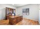 Charming office featuring a large wooden desk, wood floors and a large window for natural light at 22678 E Lake Pl, Centennial, CO 80015