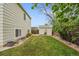 Lush backyard with a shed, green lawn, and landscaped edges, providing a serene outdoor retreat at 4856 S Quintero Cir, Aurora, CO 80015
