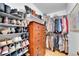 Walk-in closet featuring an organization system of shelves and rods at 4856 S Quintero Cir, Aurora, CO 80015